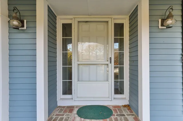 a view of a door and a window