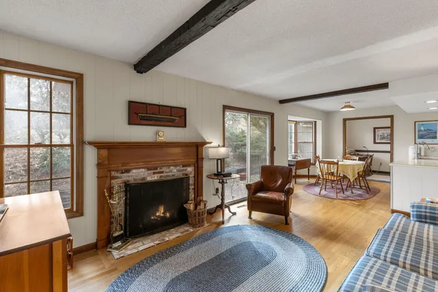 a large kitchen with kitchen island a large window