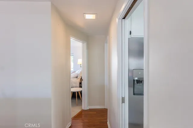 a wooden bench sitting in front of house