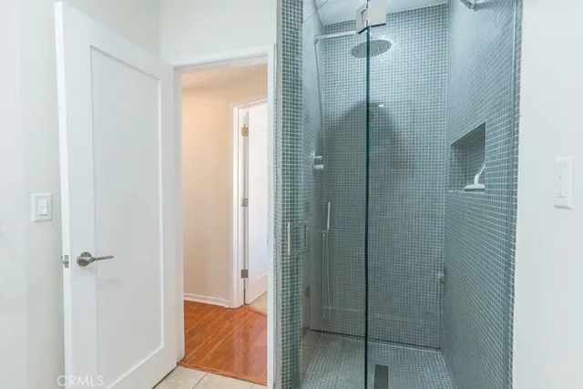 an aerial view of a house with a yard and a large pool