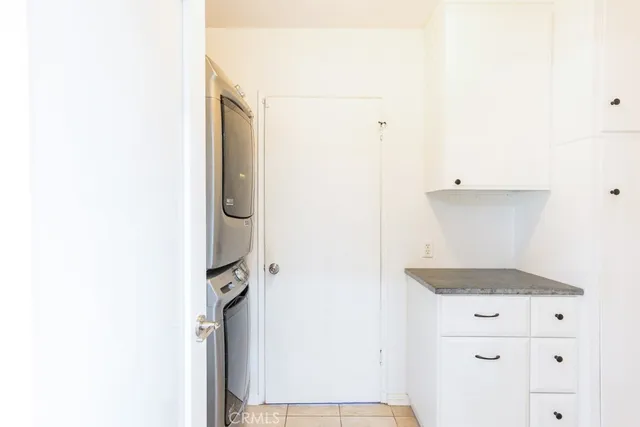 an aerial view of residential houses with outdoor space and street view