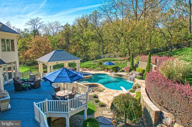 a view of a deck with couches table and chairs