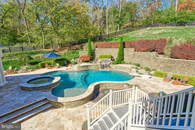 a view of a swimming pool with a patio