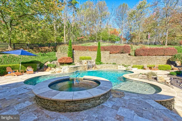 a view of a swimming pool with a lounge chairs