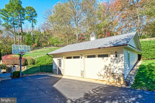 an aerial view of a house with outdoor space