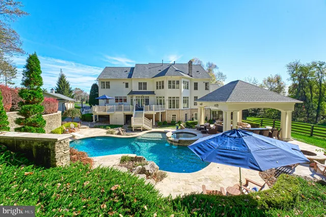 an aerial view of a house with garden space and street view