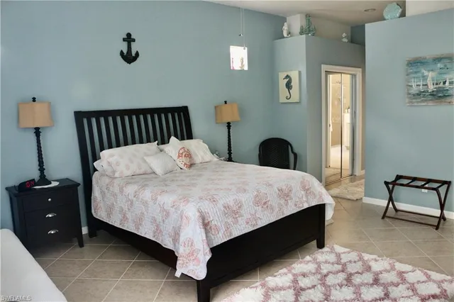 a bedroom with a bed and a chair