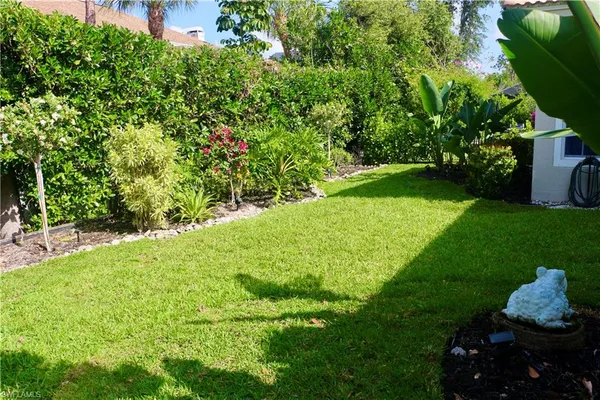 a backyard of a house with lots of green space