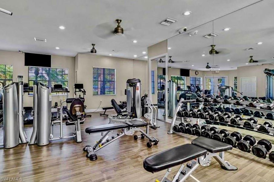 16192 Parque Lane Naples, FL 34110 - Photo 22 of 30 a view of a room with gym equipment and a large window