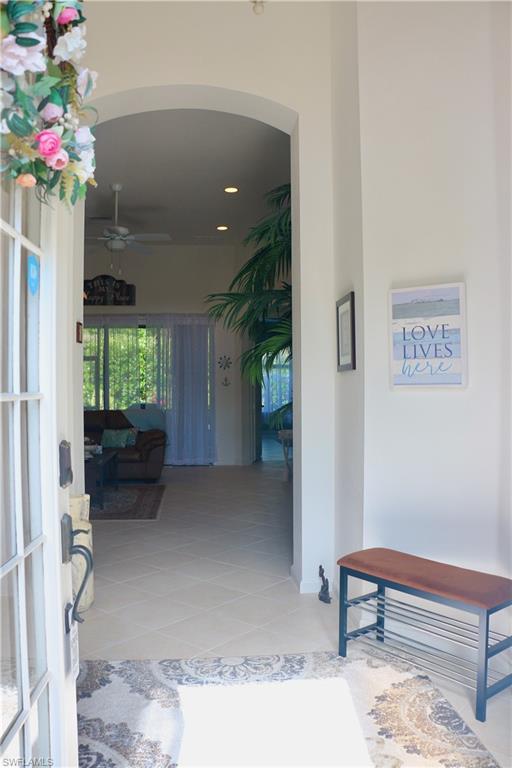 16192 Parque Lane Naples, FL 34110 - Photo 4 of 30 a living room with furniture and a potted plant
