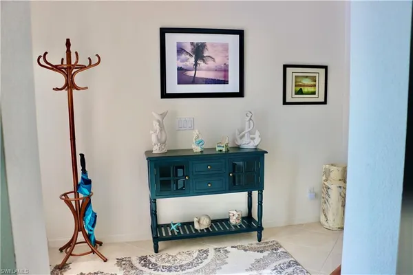 a living room with furniture and a rug