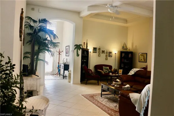 a living room with furniture a lamp and a fireplace