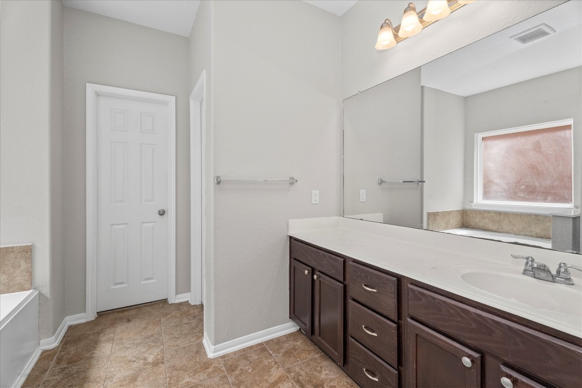 23502 Breckenridge Dale Lane Spring, TX 77373 - Photo 14 of 24 a bathroom with a sink double vanity and a mirror