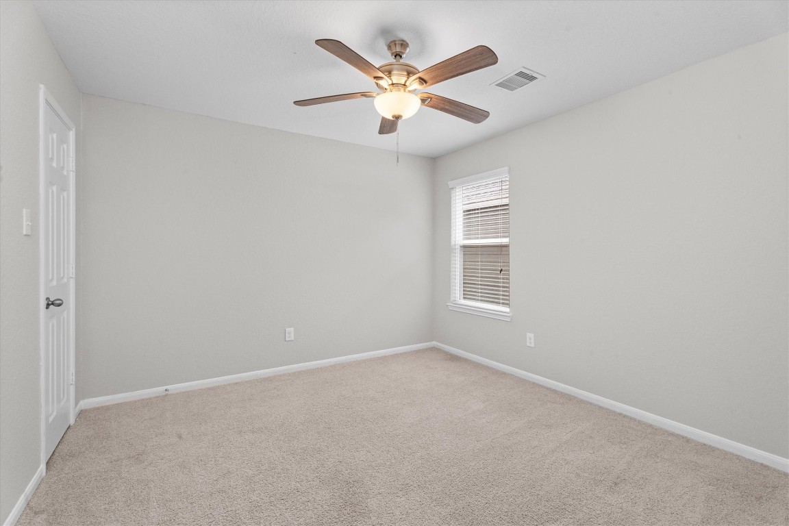 23502 Breckenridge Dale Lane Spring, TX 77373 - Photo 18 of 24 an empty room with closet and ceiling fan