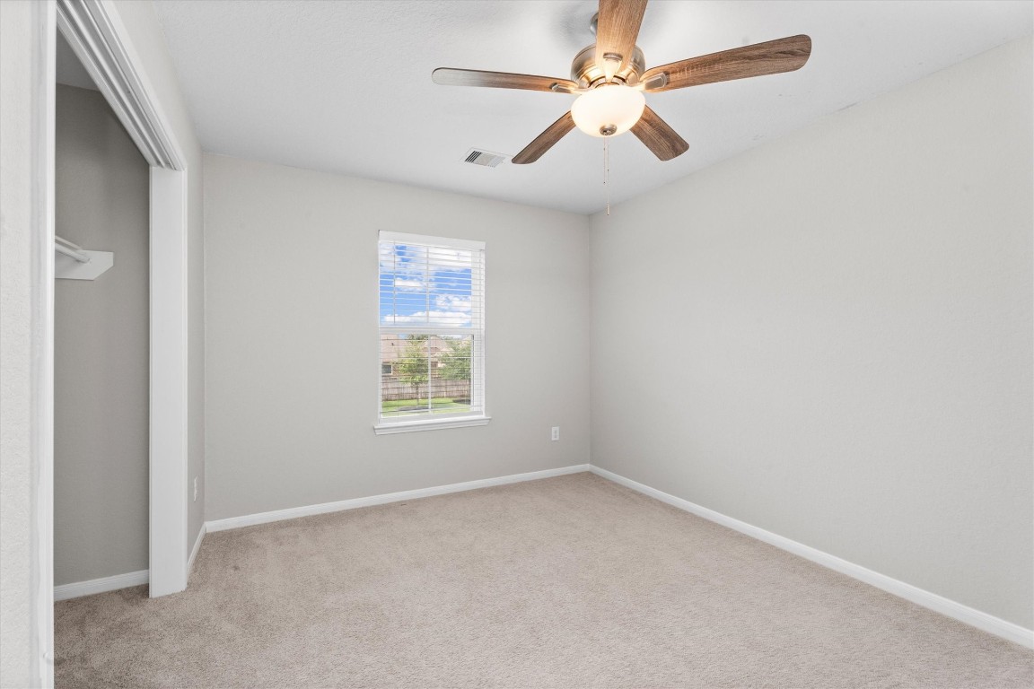 23502 Breckenridge Dale Lane Spring, TX 77373 - Photo 20 of 24 an empty room with a window and a fan