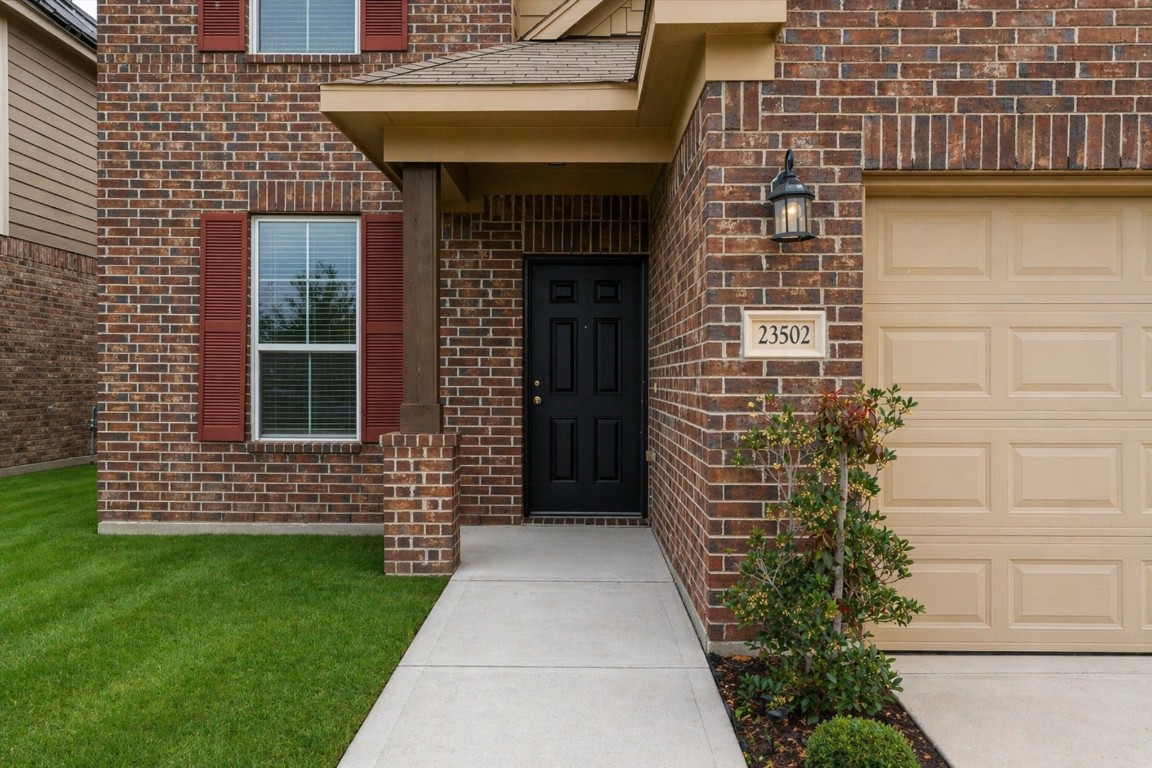 23502 Breckenridge Dale Lane Spring, TX 77373 - Photo 2 of 24 a front view of a house with a garden
