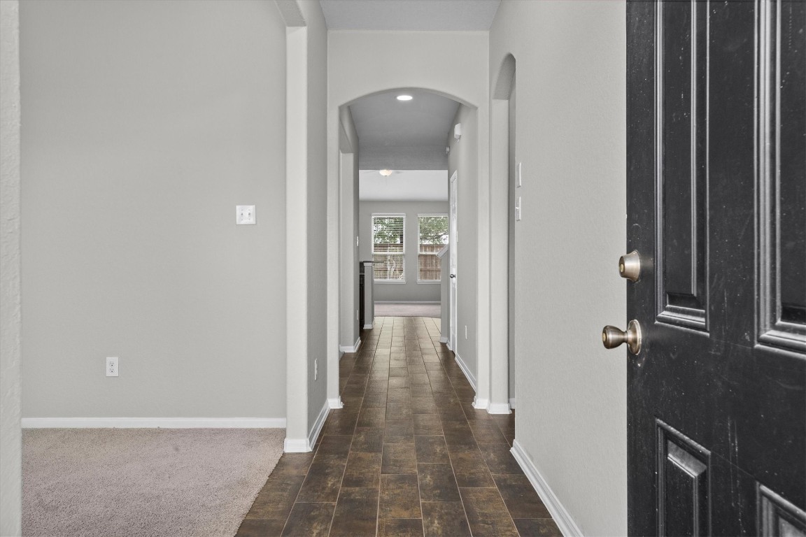 23502 Breckenridge Dale Lane Spring, TX 77373 - Photo 3 of 24 a view of a hallway with wooden floor and a bathroom