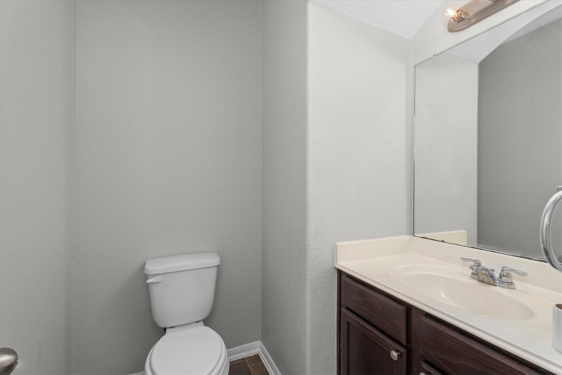 23502 Breckenridge Dale Lane Spring, TX 77373 - Photo 5 of 24 a bathroom with a toilet sink and mirror