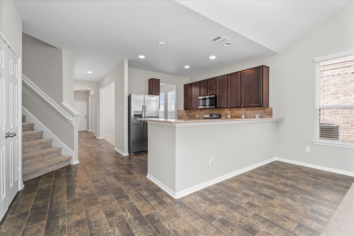 23502 Breckenridge Dale Lane Spring, TX 77373 - Photo 10 of 24 a view of kitchen with wooden floor and electronic appliances