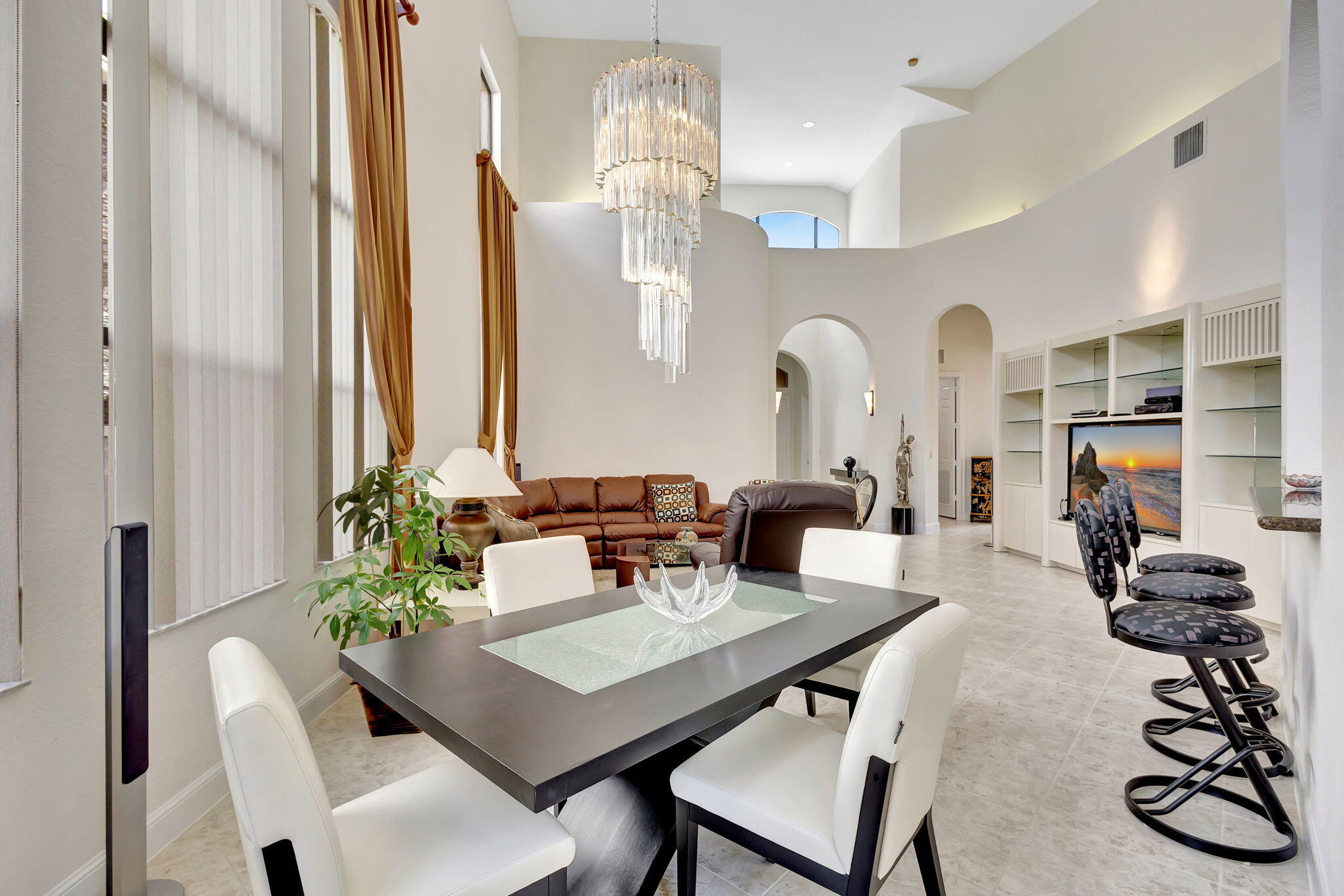 3553 Collonade Drive Wellington, FL 33449 - Photo 11 of 76 a view of a dining room with furniture and chandelier