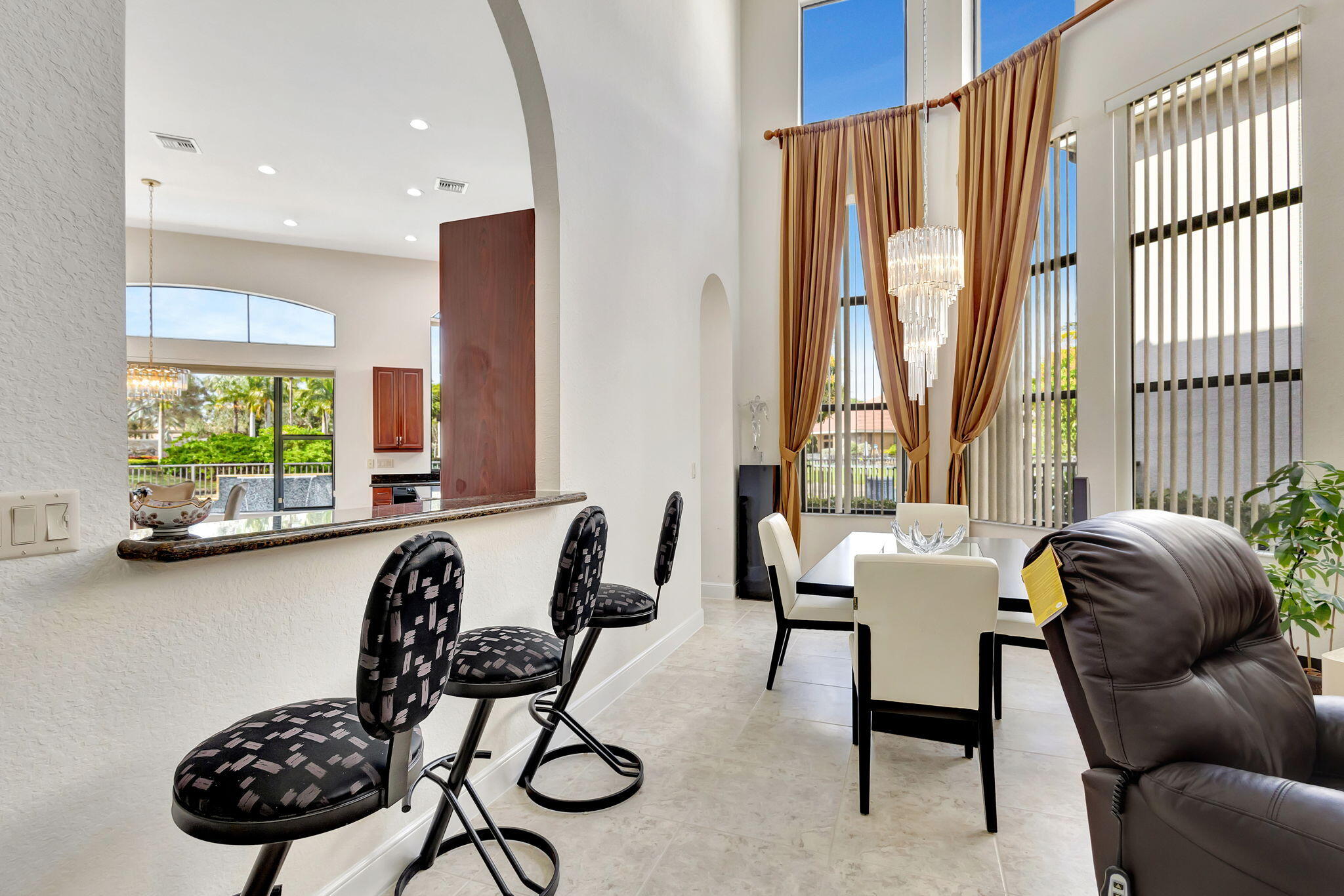 3553 Collonade Drive Wellington, FL 33449 - Photo 12 of 76 a view of a livingroom with workspace and a window