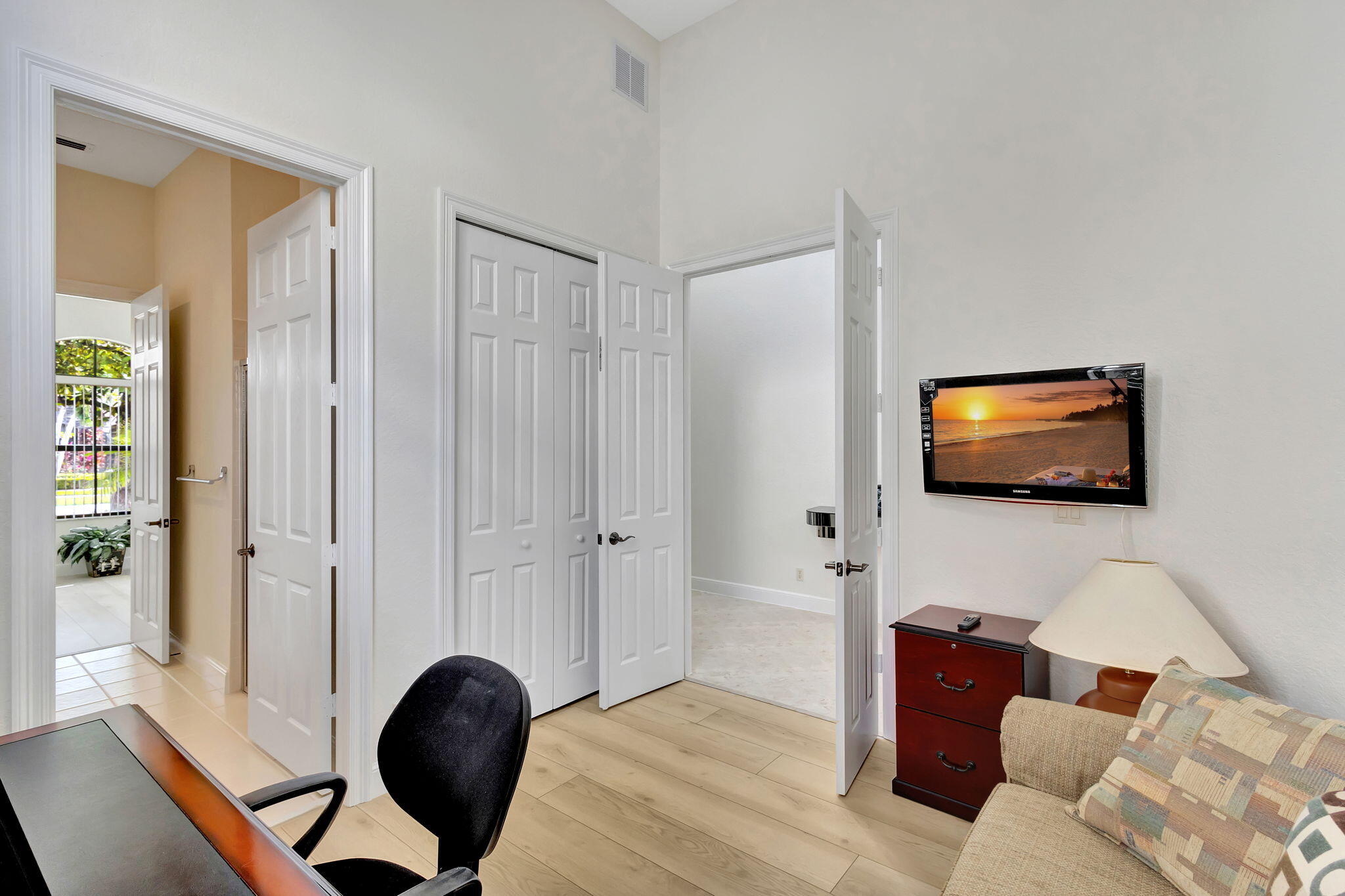 3553 Collonade Drive Wellington, FL 33449 - Photo 33 of 76 a living room with furniture and a flat screen tv