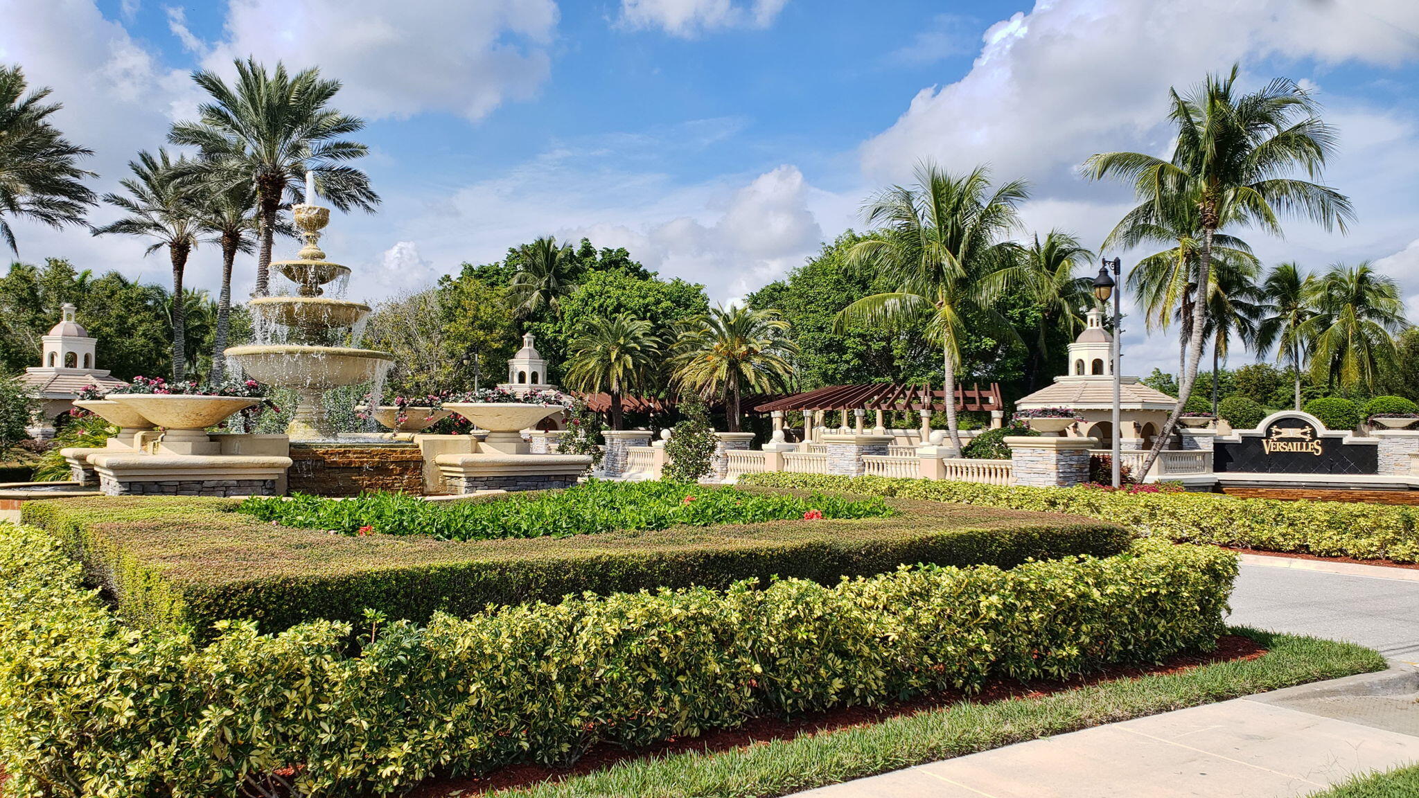 3553 Collonade Drive Wellington, FL 33449 - Photo 56 of 76 a view of a house with swimming pool and a garden
