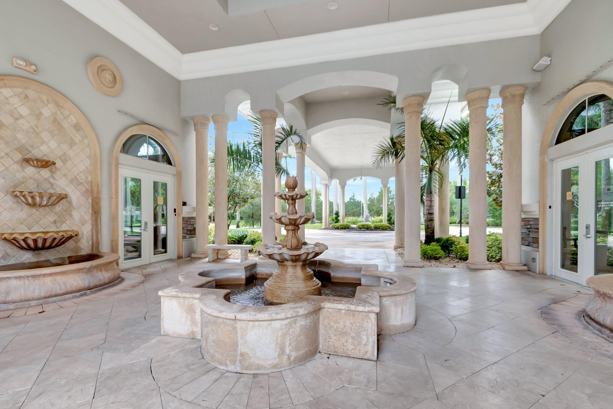 3553 Collonade Drive Wellington, FL 33449 - Photo 67 of 76 a living room with fireplace furniture and a potted plant