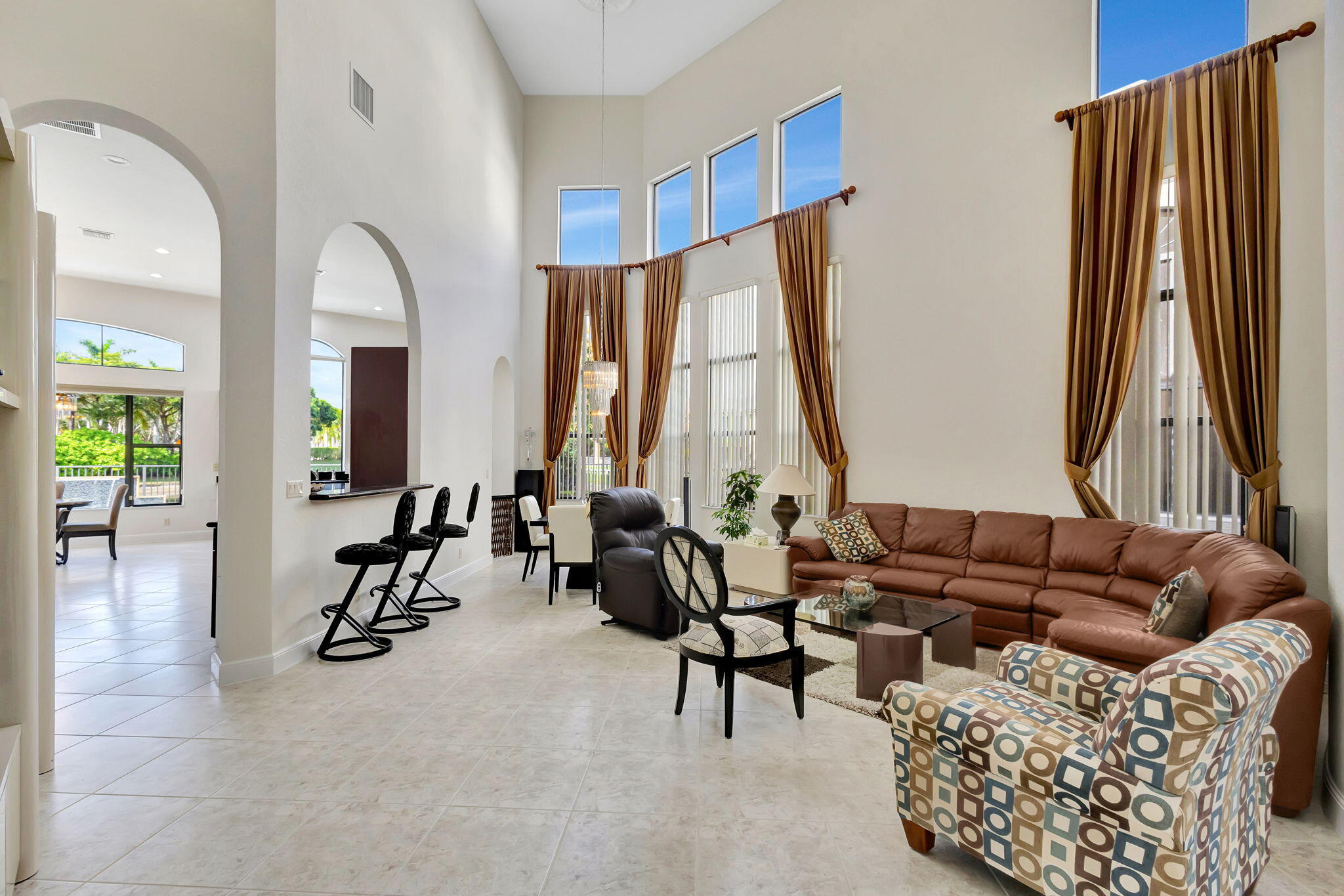 3553 Collonade Drive Wellington, FL 33449 - Photo 9 of 76 a living room with furniture and a large window