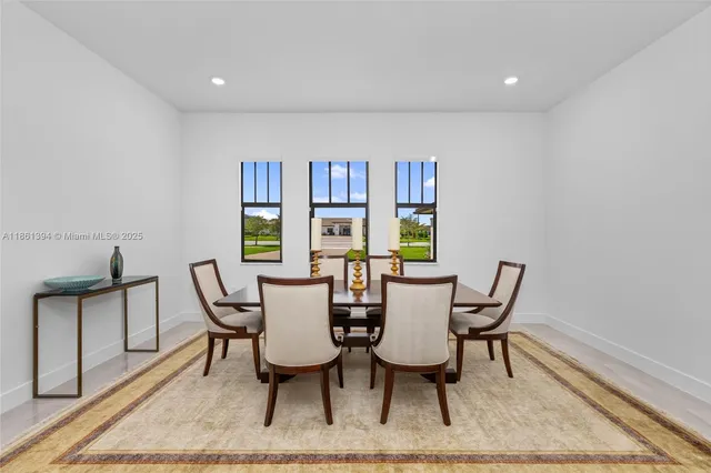 a dining room with furniture and window