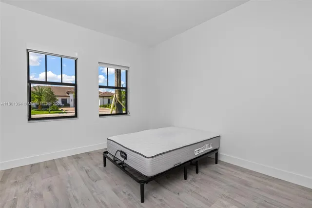 a room with a bed and a window