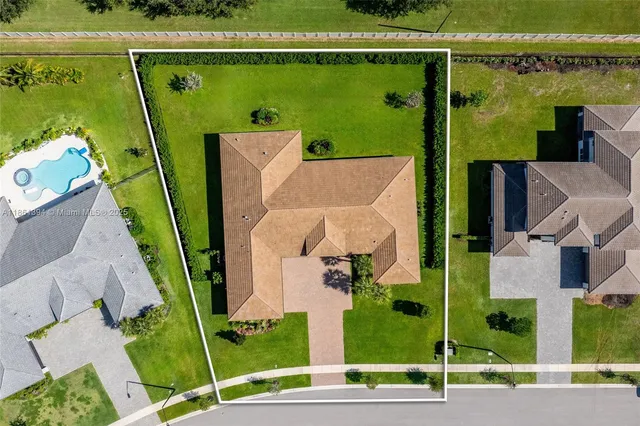 an aerial view of a house with a garden