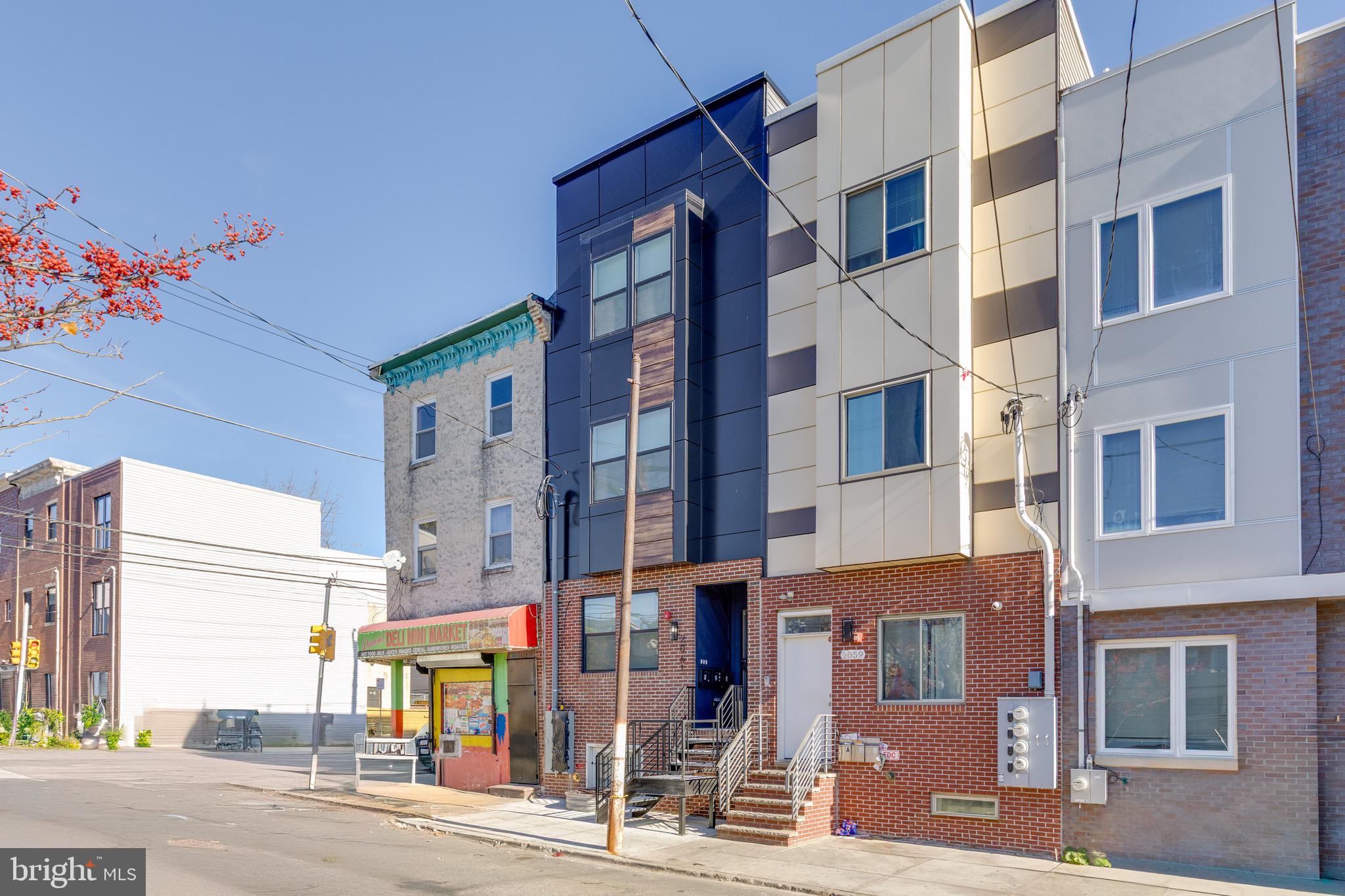 2061 North 8th Street, Unit 2 Philadelphia, PA 19122 - Photo 10 of 11 a city street lined with tall buildings