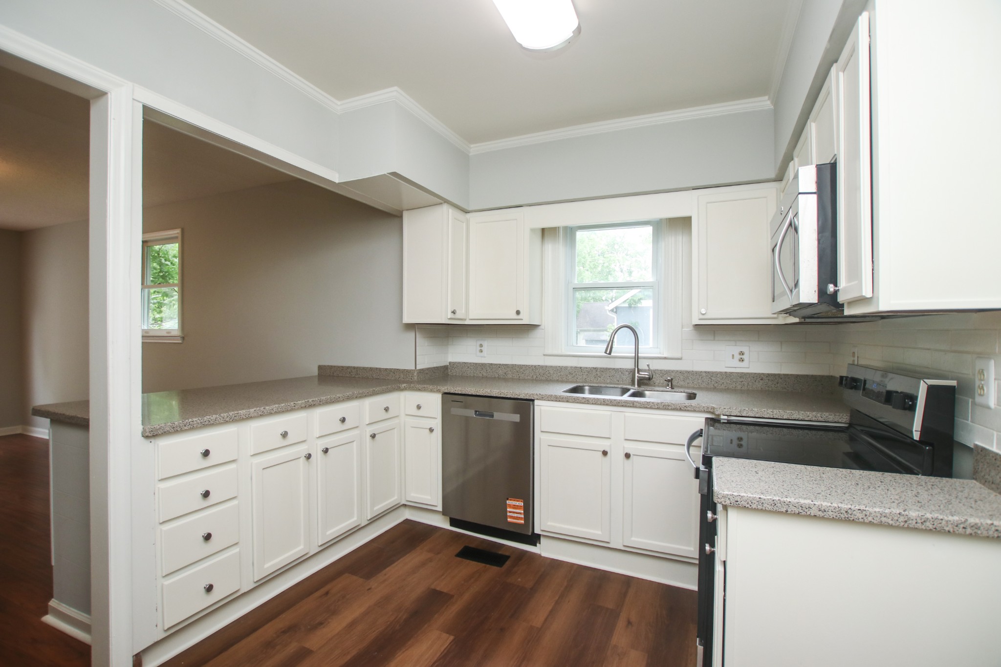 828 East Castle Street Murfreesboro, TN 37130 - Photo 1 of 56 a kitchen with granite countertop white cabinets and white appliances