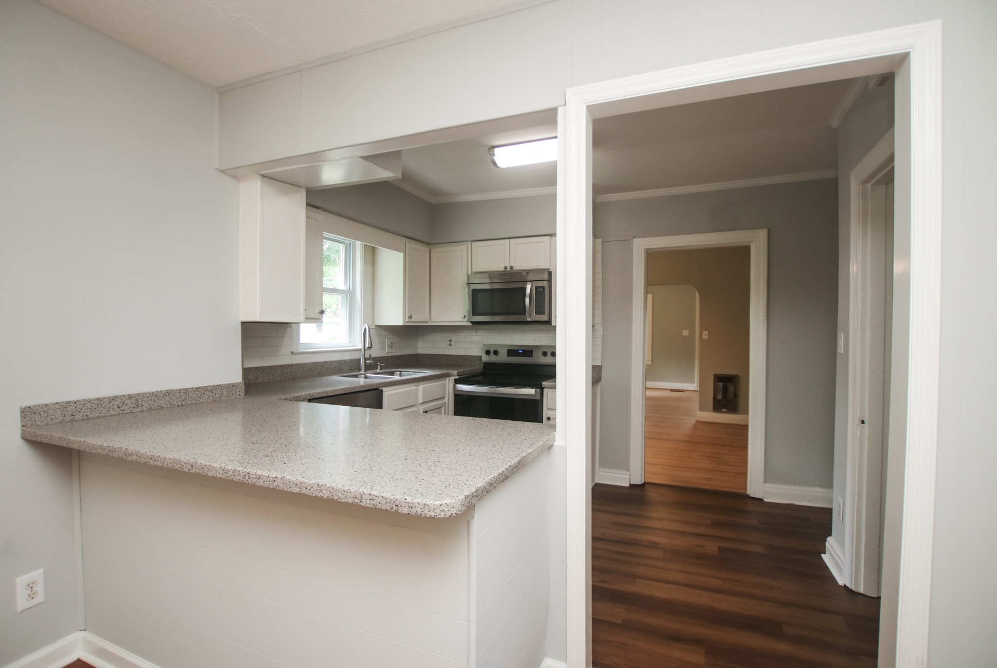 828 East Castle Street Murfreesboro, TN 37130 - Photo 36 of 56 a kitchen with stainless steel appliances a sink a stove and microwave