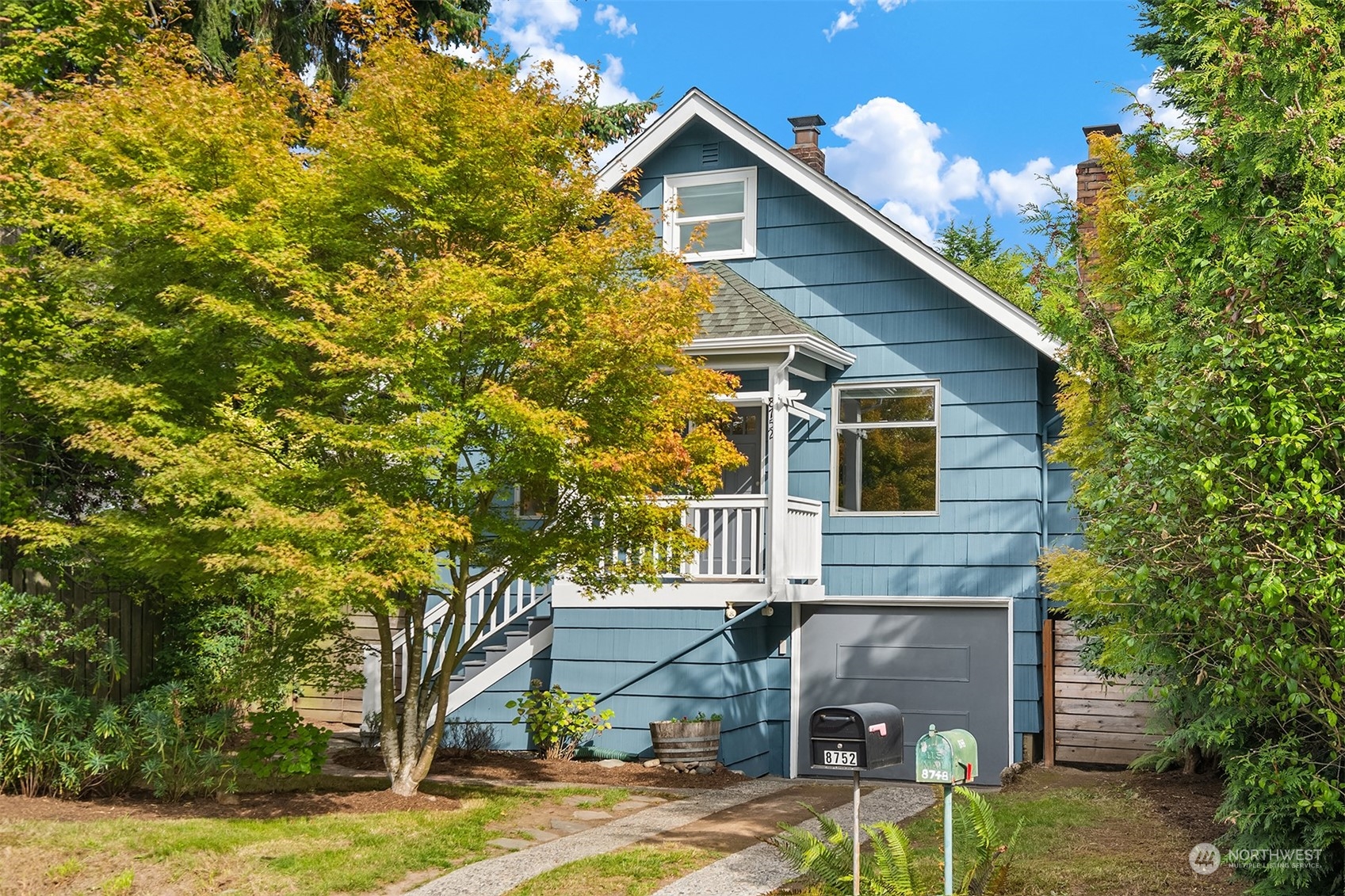 8752 Evanston Avenue North Seattle, WA 98103 - Photo 1 of 29 a front view of a house with garden