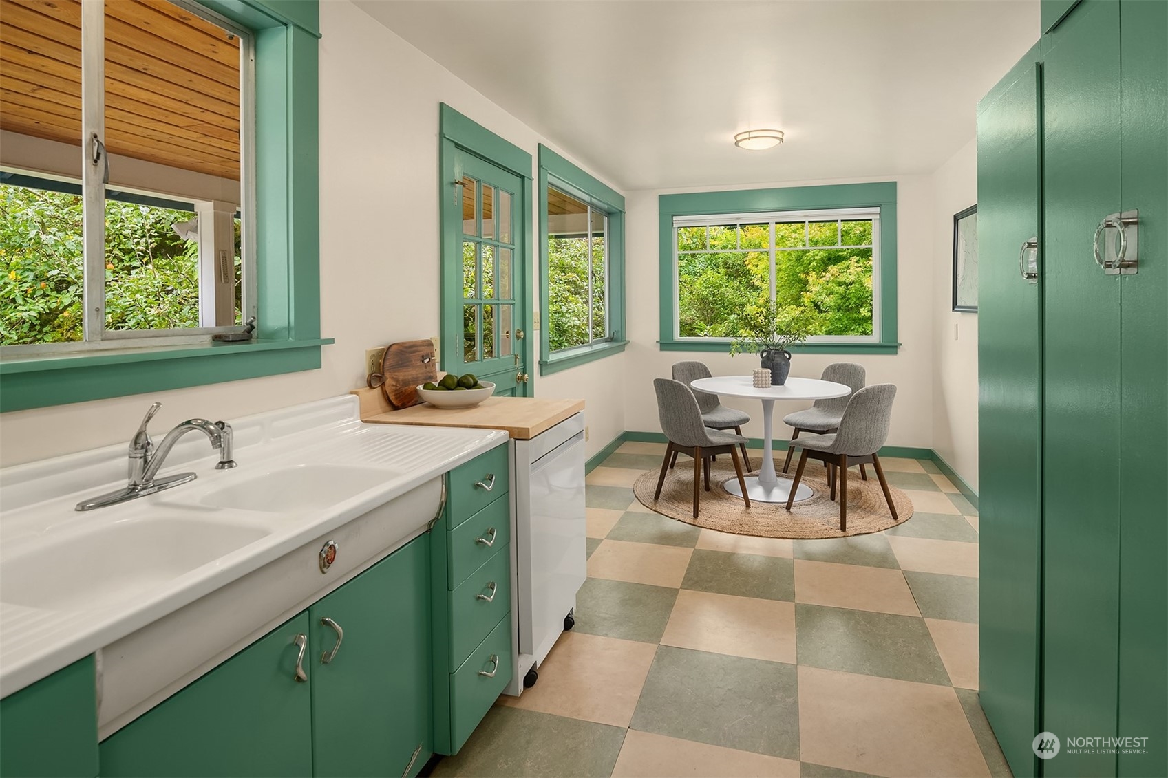 8752 Evanston Avenue North Seattle, WA 98103 - Photo 12 of 29 a dining room with a balcony view and a large window