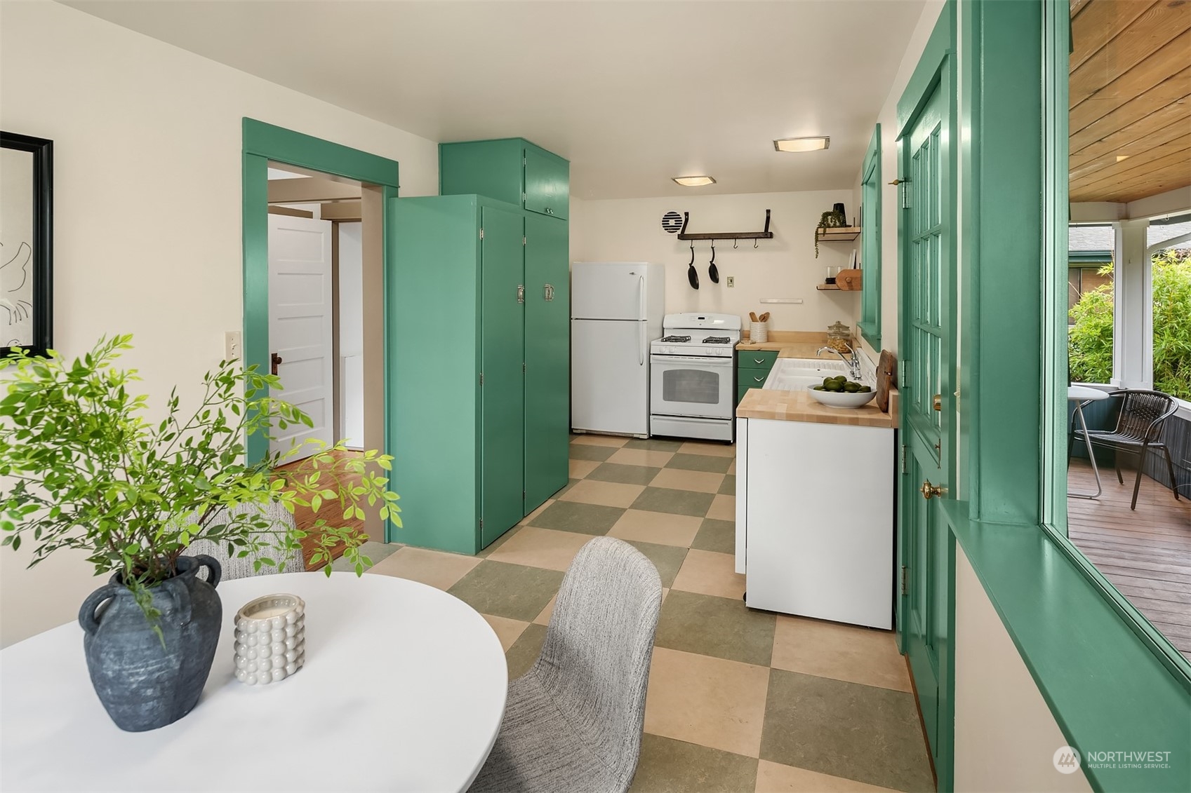 8752 Evanston Avenue North Seattle, WA 98103 - Photo 13 of 29 a view of kitchen with furniture and refrigerator