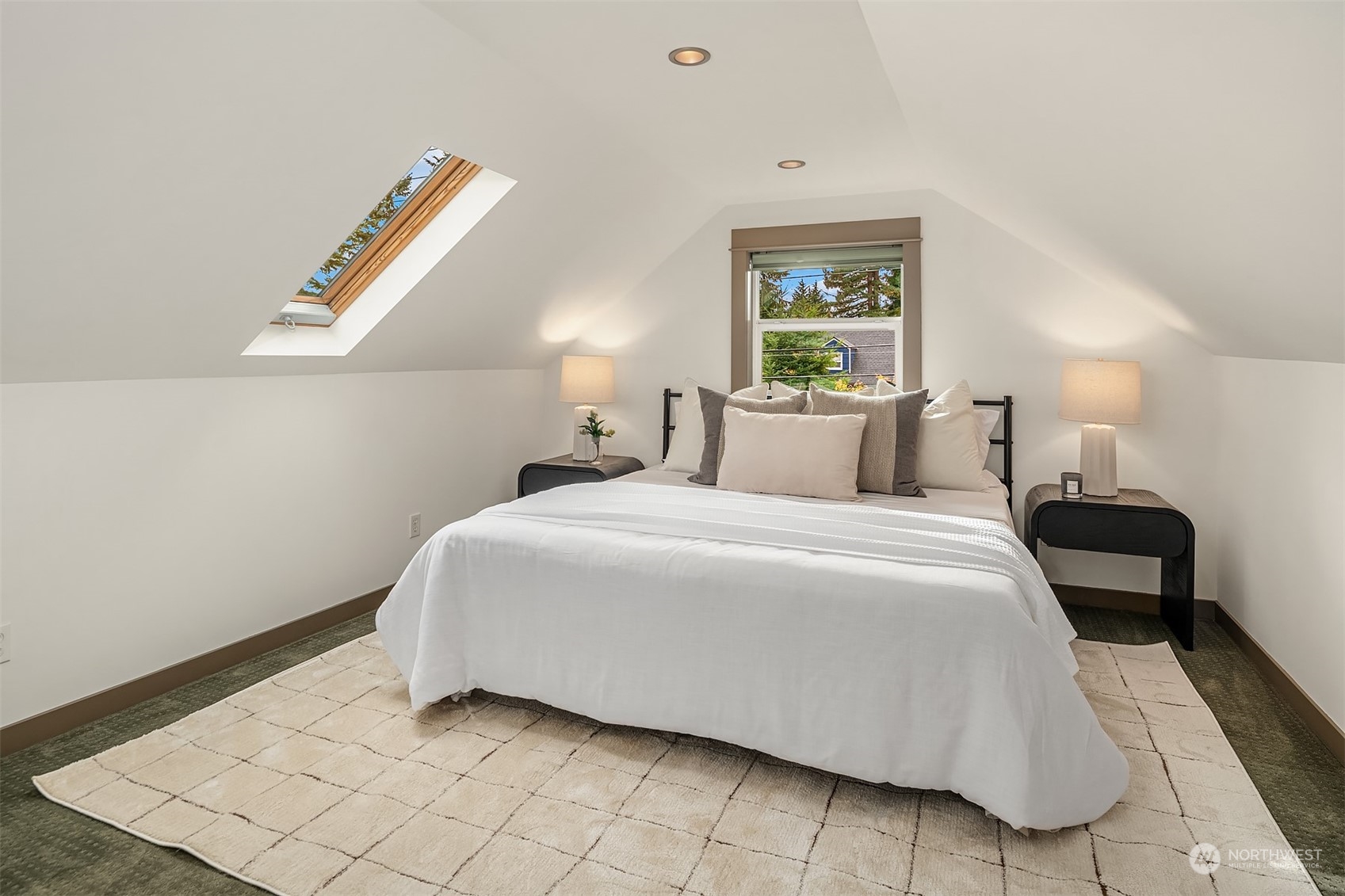 8752 Evanston Avenue North Seattle, WA 98103 - Photo 19 of 29 a bedroom with a bed and a window