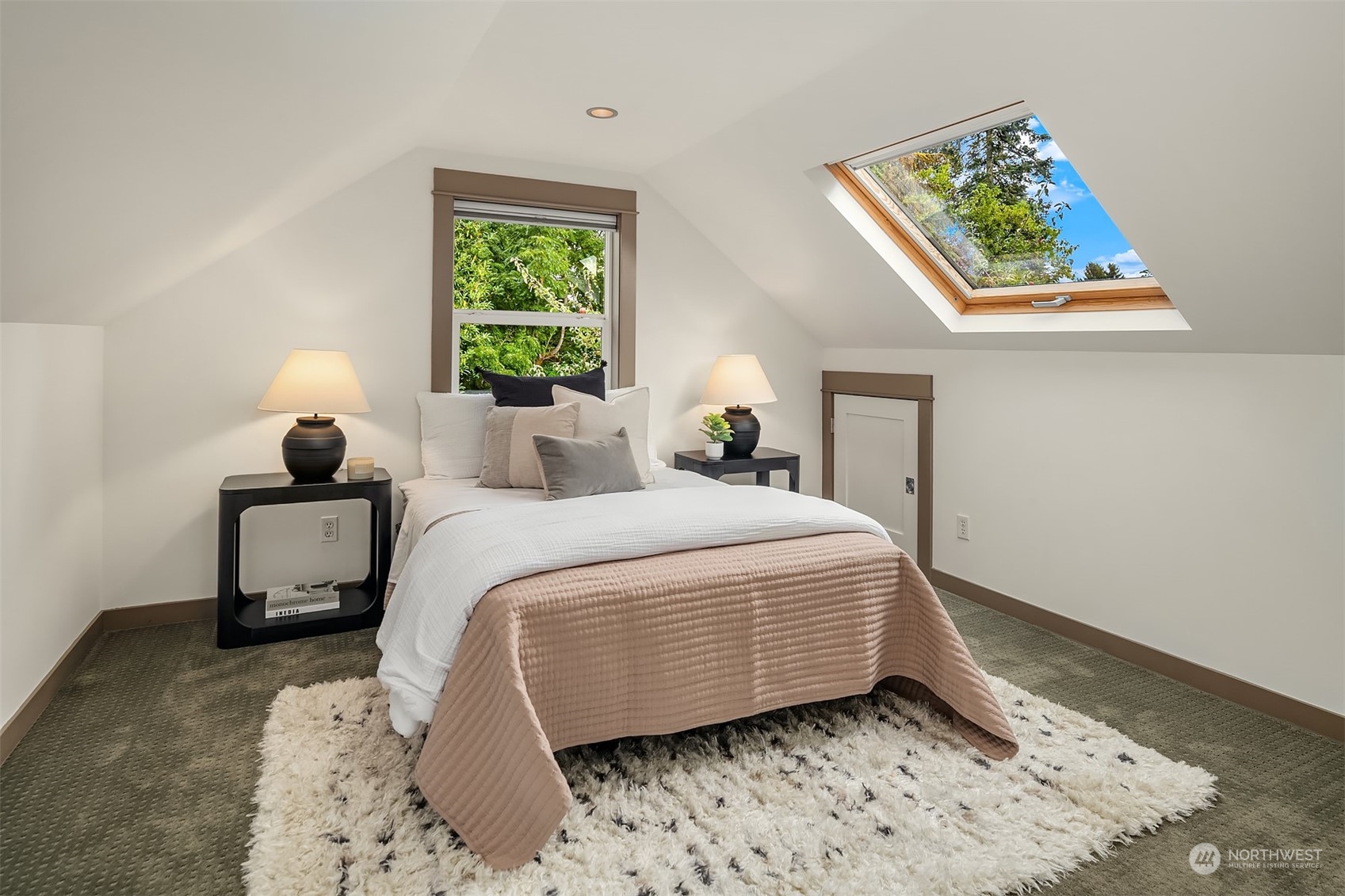 8752 Evanston Avenue North Seattle, WA 98103 - Photo 21 of 29 a bedroom with a bed and a window