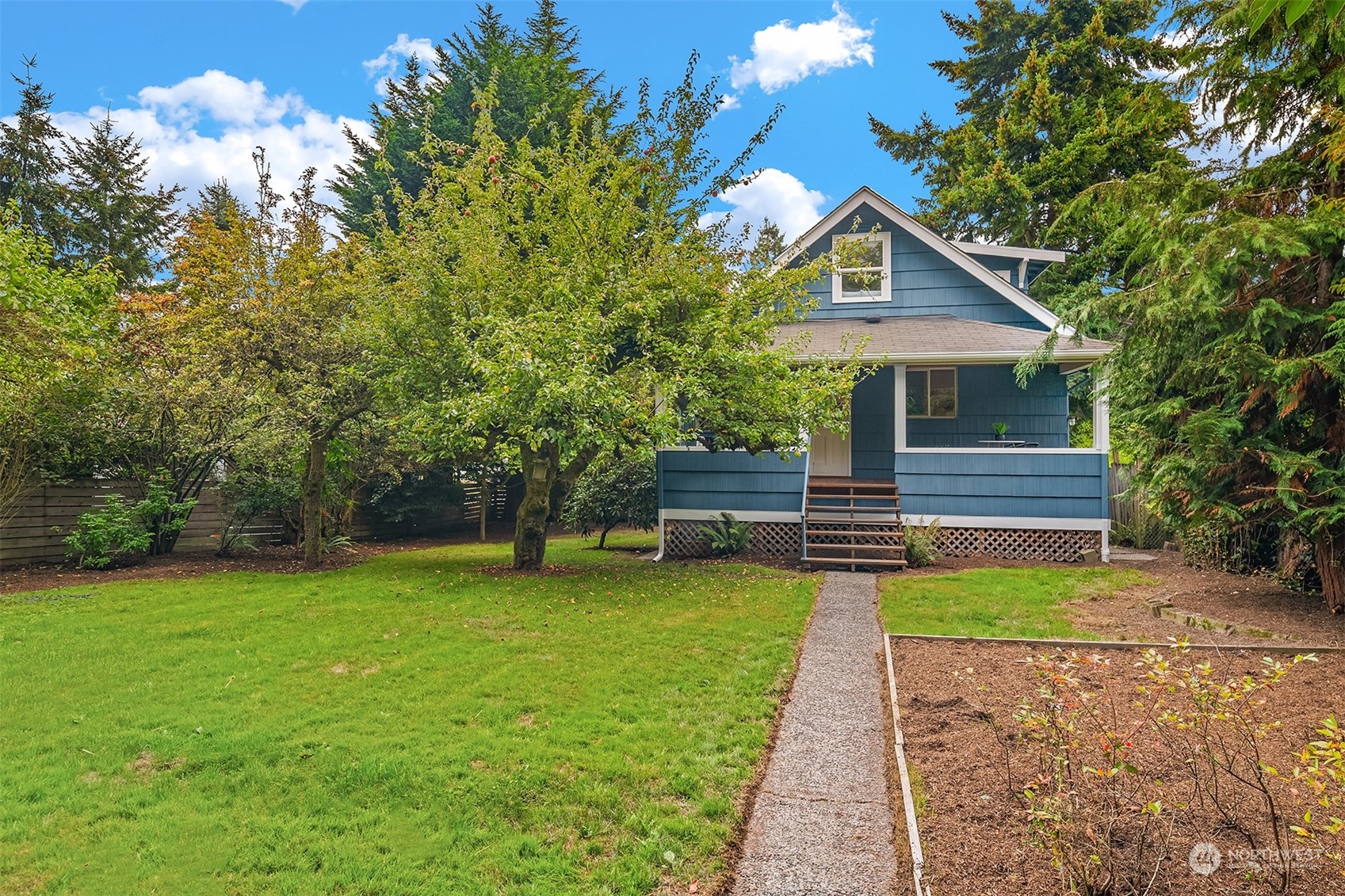 8752 Evanston Avenue North Seattle, WA 98103 - Photo 27 of 29 a front view of a house with garden