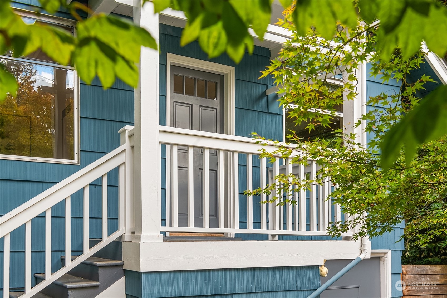 8752 Evanston Avenue North Seattle, WA 98103 - Photo 3 of 29 a view of a house with a small yard