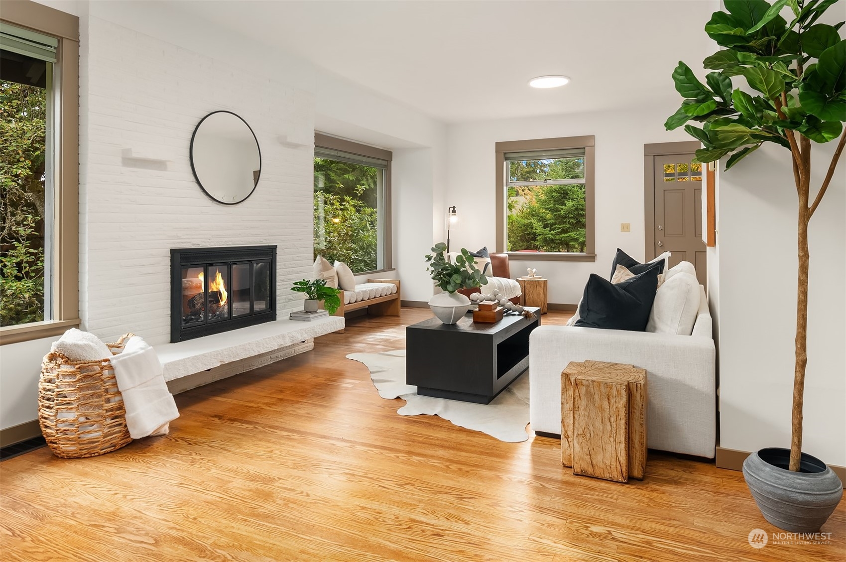 8752 Evanston Avenue North Seattle, WA 98103 - Photo 6 of 29 a living room with furniture and a fireplace