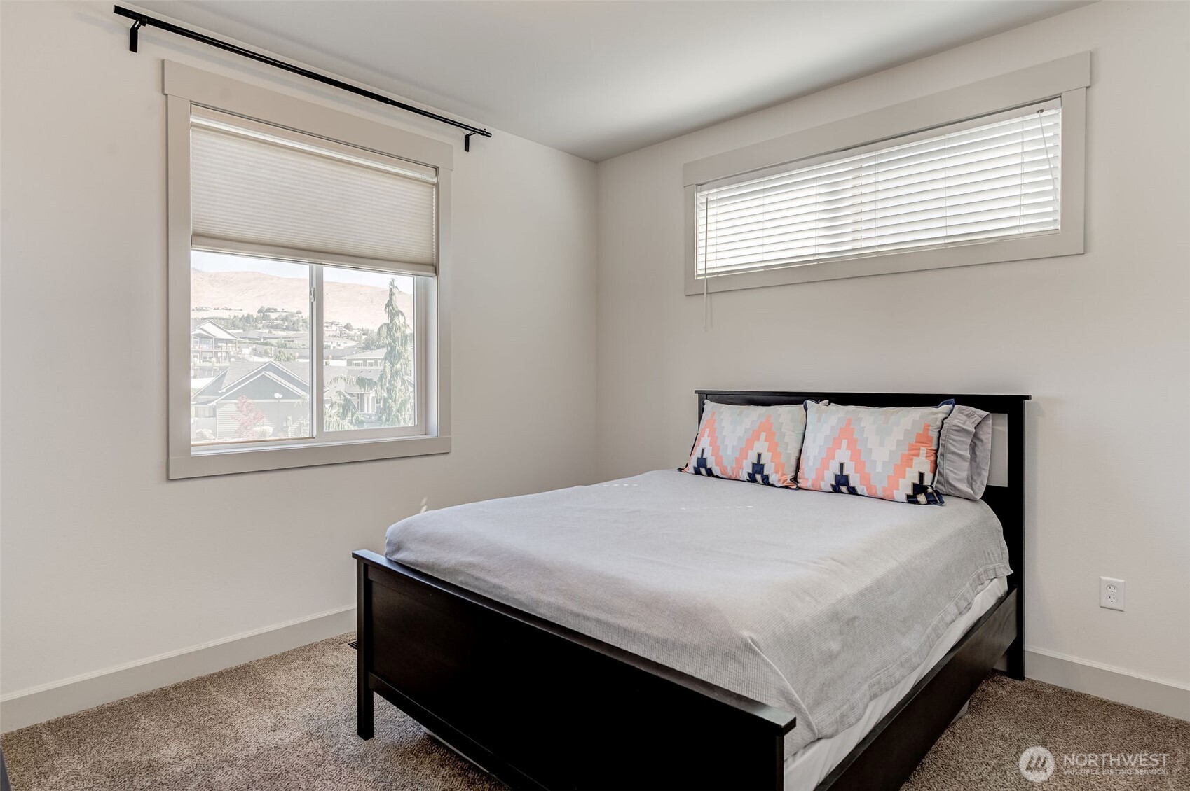 826 Autumn Crest Drive Wenatchee, WA 98801 - Photo 21 of 38 a large bed sitting in a bedroom next to a window