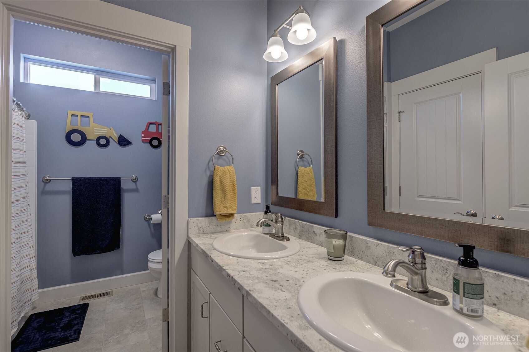 826 Autumn Crest Drive Wenatchee, WA 98801 - Photo 23 of 38 a bathroom with a granite countertop sink and a mirror