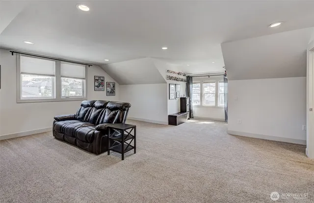 a living room with furniture window and a table