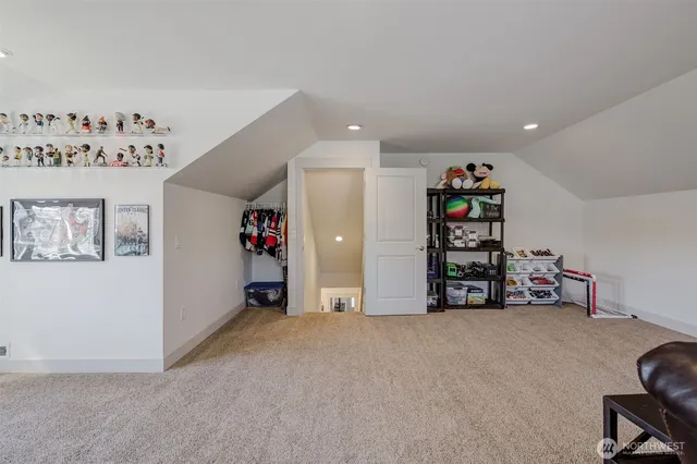 a view of an empty room with shelves and toys