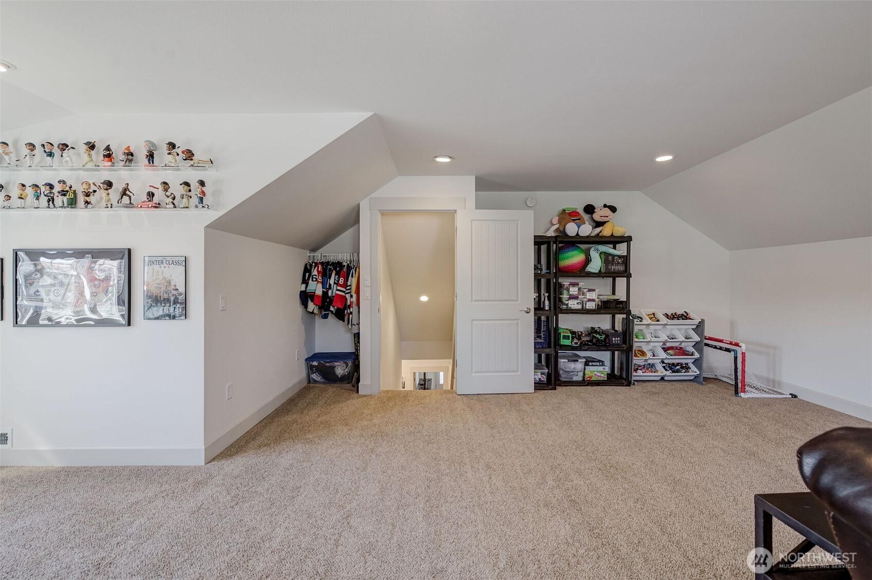 826 Autumn Crest Drive Wenatchee, WA 98801 - Photo 32 of 38 a view of an empty room with shelves and toys