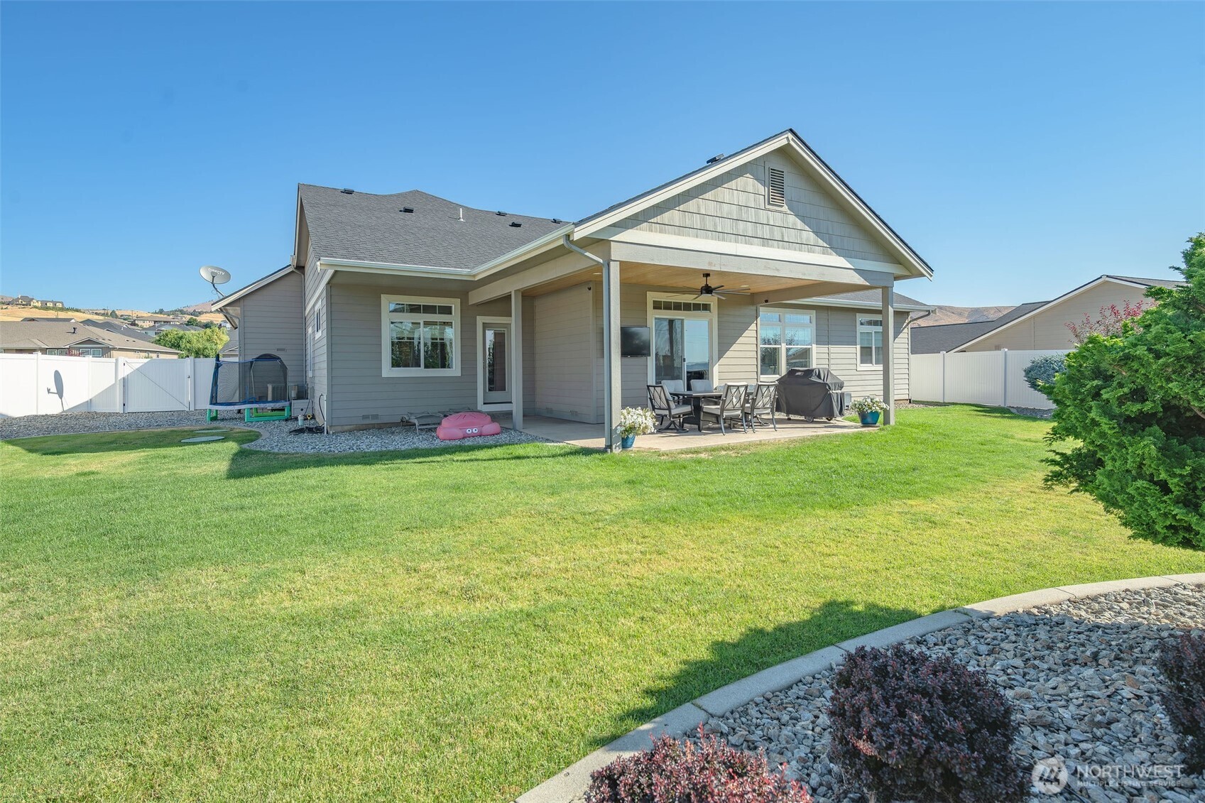826 Autumn Crest Drive Wenatchee, WA 98801 - Photo 33 of 38 a front view of a house with garden and porch