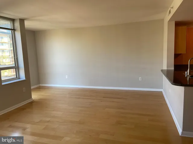 a bathroom with a toilet and a shower curtain
